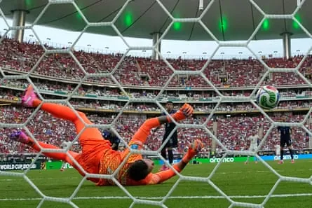 Uruguay goalkeeper Fernando Muslera fumbles Alex Baena’s shot over the line