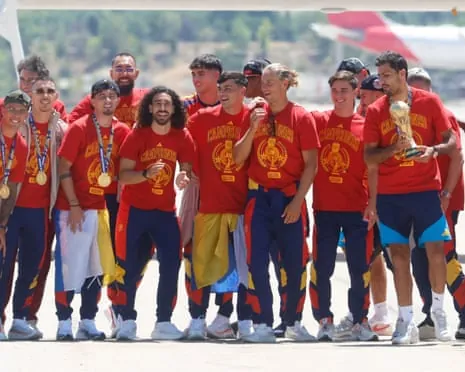 The Spain squad disembark from their flight home at Madrid’s Barajas airport on Monday