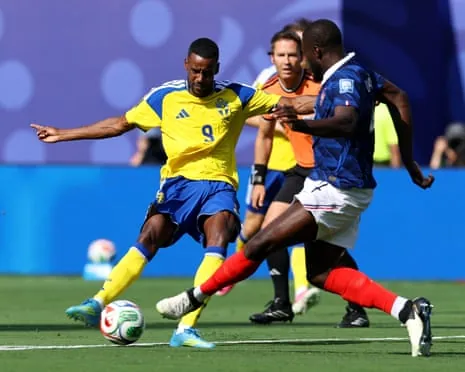Alexander Isak of Sweden shoots against France