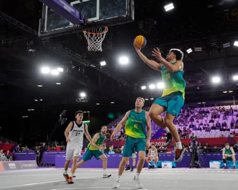 Australia’s Sam McDaniel of Australia drives to the basket to score during his team's 3x3 basketball victory over New Zealand