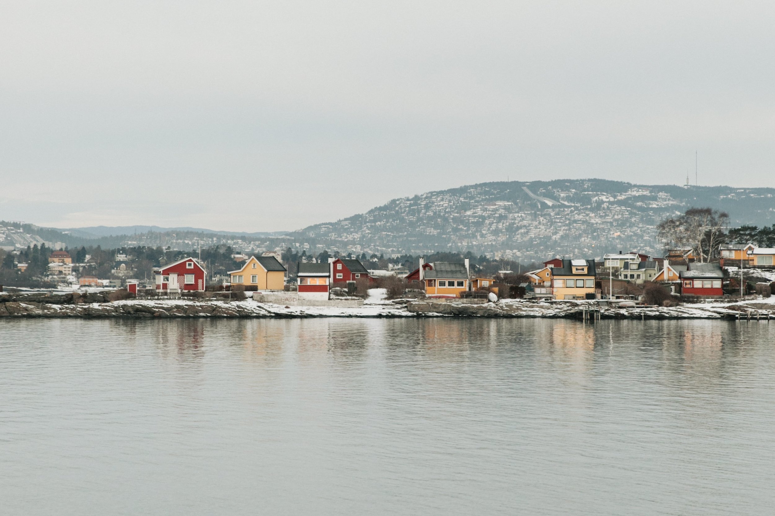 Colourful houses in the Oslofjord in winter